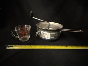 lot 14 image: Foley Original Food Mill 2 Qt  & Pyrex D Handle Measuring Cup