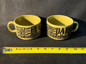 lot 31 image: Two Ceramic Mugs - MotherFather Word-Art Typography, Japan, Olive Glaze (2-Piece Set)