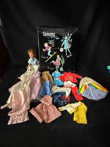 lot 53 image: Tammy Fashion Doll with Assorted Vintage Outfits in Black Illustrated Travel Case