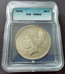 lot 54 image: 1923 Peace Dollar - ICG MS65