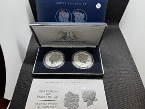 lot 100 image: 2024 Reverse Proof Morgan and Peace Silver Dollars - Two Coin Set - Spectacular Coins