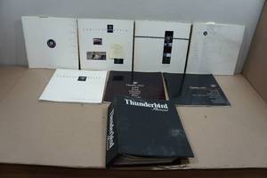 lot 165 image: Vintage Thunderbrid and Cadillac Sales Brochures