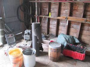 lot 198 image: Contents of corner including buckets, a wood barrel, tar paper, motor and more