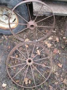 lot 31 image: Pair of Antique metal wagon impleme...