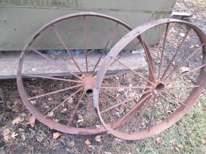lot 32 image: Pair of Antique metal wagon impleme...