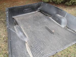 lot 34 image: Ford branded pick up truck bed line...