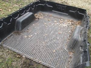 lot 35 image: Rugged Liner branded truck bed line...