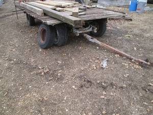 lot 2 image: Hay wagon trailer with lumber, much...