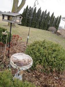 lot 96 image: Bird feeder bird bath and shepherd ...