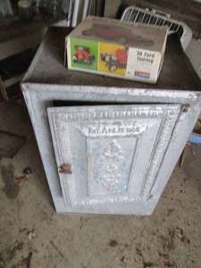 lot 106 image: 1904 Metal cabinet and 30 Ford Must...