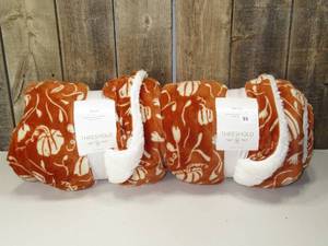 lot 55 image: Threshold Plush Pumpkin Throw with Faux Shearling Reverse 50x60  (set of 2)