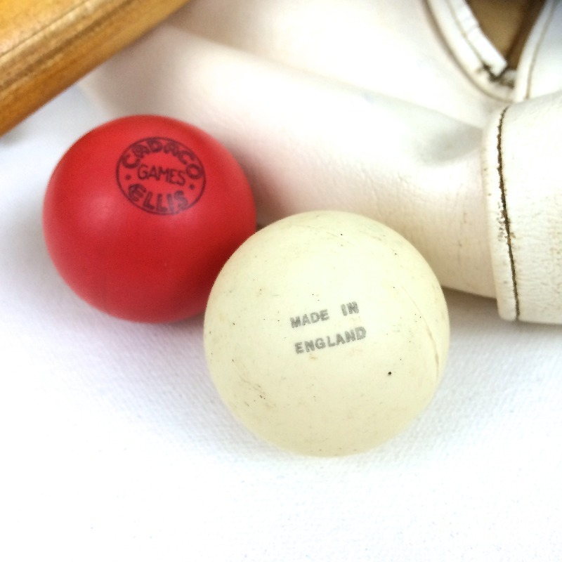 lot 15 image: Vintage varnished hardwood bowling pin with Vintage English ping pong paddle set.