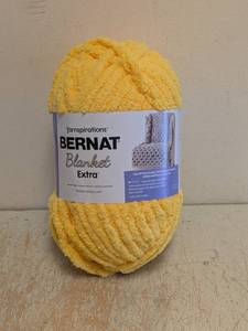 lot 19 image: NEW YARNSPIRATIONS BERNAT BLANKET EXTRA YELLOW