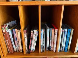 lot 67 image: DVD Collection - Assorted Movies & TV Titles on Wooden Shelf