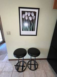 lot 96 image: Black Metal Bar Stools (Lot of 2) & Framed Floral Print
