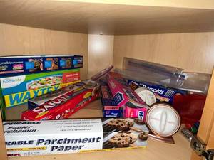 lot 102 image: Reynolds Plastic Wrap, Saran Wrap, WaxTex Wax Paper & Parchment Paper - Kitchen Wraps - content quantities unverified