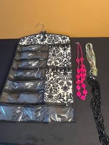 lot 207 image: Hanging Jewelry Organizer with Clear Pockets - Includes 3 Beaded Necklaces