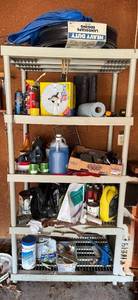 lot 320 image: Four-Shelf Metal Garage Shelving Unit - Automotive Fluids, Tools & Supplies - content quantities unverified