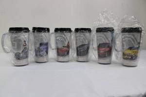 lot 37 image: Matco Classics Travel Mugs - Car & Model Theme (Set of 7)