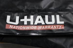 lot 42 image: U-Haul Black MovingStorage Bag - 60in Long, Zipper, Straps