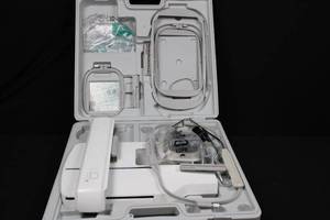 lot 70 image: Embroidery Machine Bundle - White Case With Hoops & Attachments