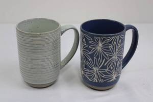 lot 73 image: Laurie Gates Mugs - Blue Floral & Green Ribbed Ceramic Coffee Cups (Lot of 2)