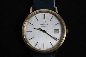 lot 121 image: Omega Quartz Wristwatch - Gold-Tone Case, Blue Leather Strap, Swiss Made Not working  condition