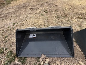 lot 55 image: WOLVERINE Unused 2026 Skid Steer Track Duty Bucket 68