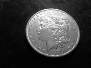 lot 13 image: 1884 O Morgan Silver Dollar