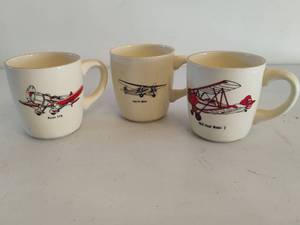lot 209 image: Three Airplane Themed Coffee Mugs