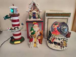 lot 234 image: Holiday Revolving Lighthouse, Tealight Holder & Skating Children Waterglobe