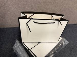 lot 17 image: 24Ct Of Black And White Gift Bags