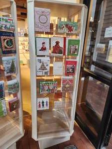 lot 1064 image: Plastic Retail Display Greeting Card Rack with Clear Plastic Shelves 21 x 21 x 70