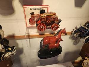 lot 1102 image: Lot of (2) Whisky Decanters - 1969 Erza Brooks Overland Express Stage Coach, 1977 Old Commonwealth Kentucky Thoroughbred Race Horse and Foal