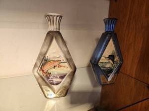 lot 1104 image: Lot of (2) 1975 Beams Choice Whisky Decanters - Rainbow Trout (by James Lockhart), Sailfish