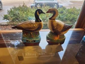 lot 1108 image: Lot of (2) Whisky Decanters - Great Canadian Honker, 1974 Erza Brooks Happy the Goose