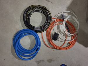 Heavy-Duty Cable Bundle - Blue Air Hoses, Orange Extension Cords, White Cables