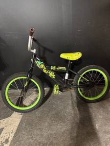 lot 109 image: Teenage Mutant Ninja Turtles Kids Bike 16-Inch Black with Neon Green Rims