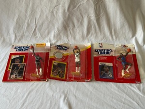 lot 101A image: (3) Starting Lineup Basketball Figures - (2) David Robinson and (1) Patrick Ewing