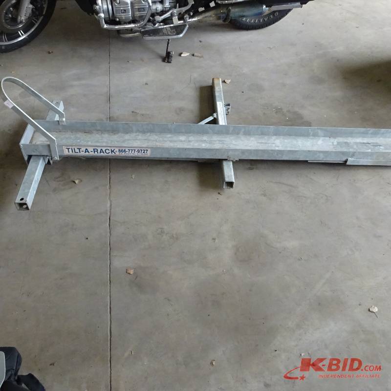 lot 7 image: Tilt a rack receiver hitch scooter carrier.