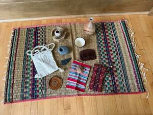lot 96 image: Assorted Tribal Artifacts on Woven Rug - Canvas Pouch, Leather Medallion, Stone Beads, Textiles