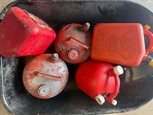 Lot of various gas cans including bucket.