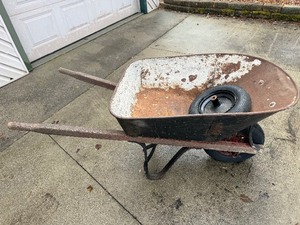 Classic Wheelbarrow with extra wheel and rim.