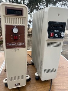 portable electric oil-filled radiators. Both powered up.