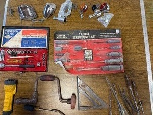 Box of cycle parts, lights , and various tools 