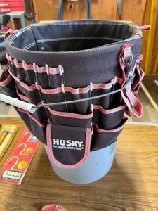 5 Gallon job site bib and various hooks and tools.