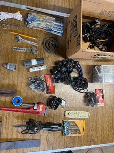 Box of fasteners, tie downs, wrenches and various.