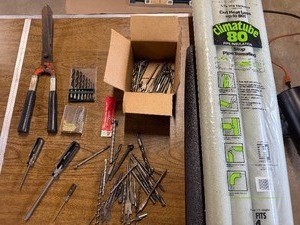 Bits, pipe insulation, grass clipper , screw drivers