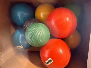 Lot of various balls , softball, croquet , baseball, golf