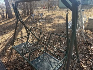 metal patio swing in green , in decent shape